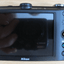Nikon Coolpix S1100pj 14 MP Digital Camera with 5x Wide Angle built - in projector - MagsTag