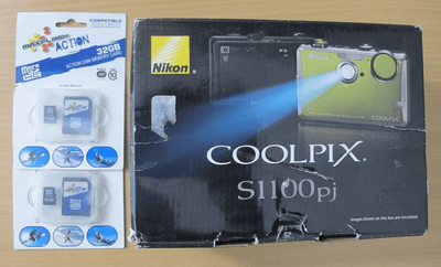 Nikon Coolpix S1100pj 14 MP Digital Camera with 5x Wide Angle built - in projector - MagsTag