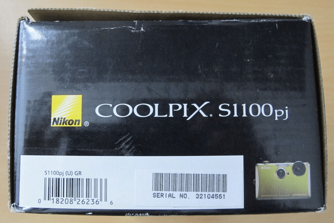 Nikon Coolpix S1100pj 14 MP Digital Camera with 5x Wide Angle built - in projector - MagsTag